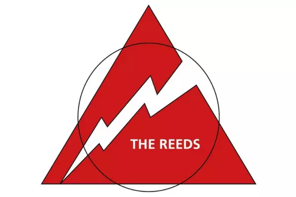 Red triangular band logo with a white lightning-style shape running through it and the text “THE REEDS” in the center.