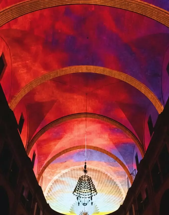 Colourful light projections illuminating the ceiling of San Cayetano church in Palma