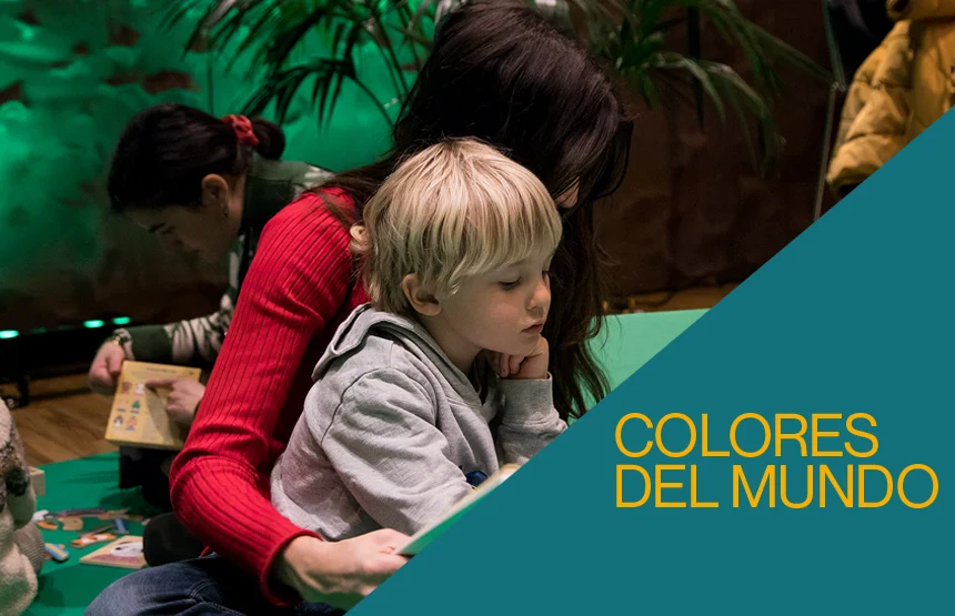A child and an adult sitting on the floor taking part in a creative activity at CaixaForum.